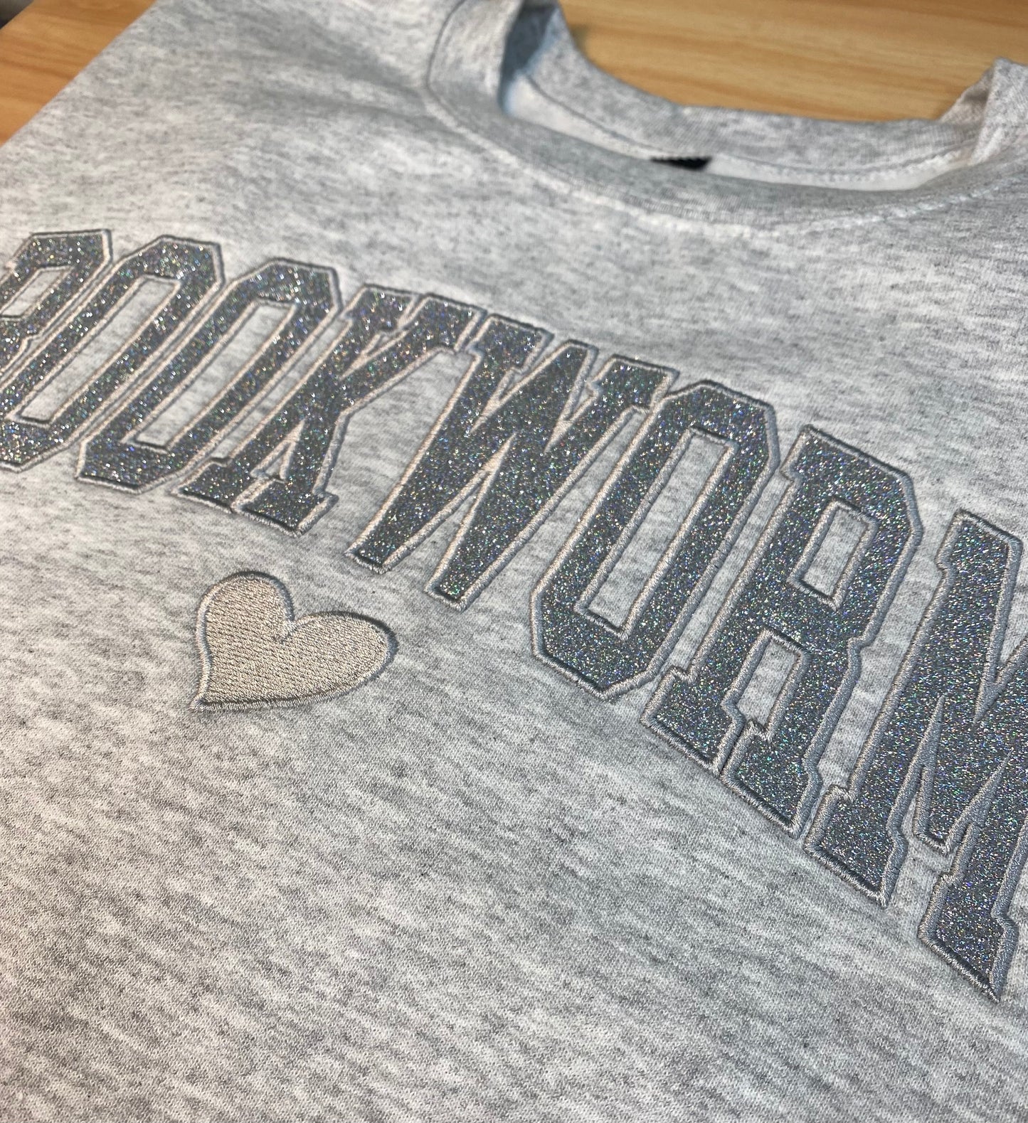 BOOKWORM Appliqué Glitter Crewneck Sweatshirt