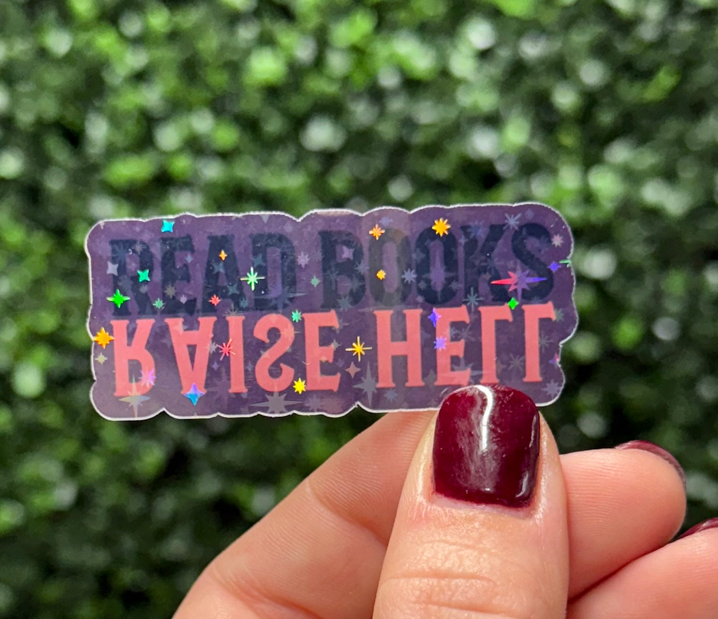 RAISE HELL READ BOOKS STICKER
